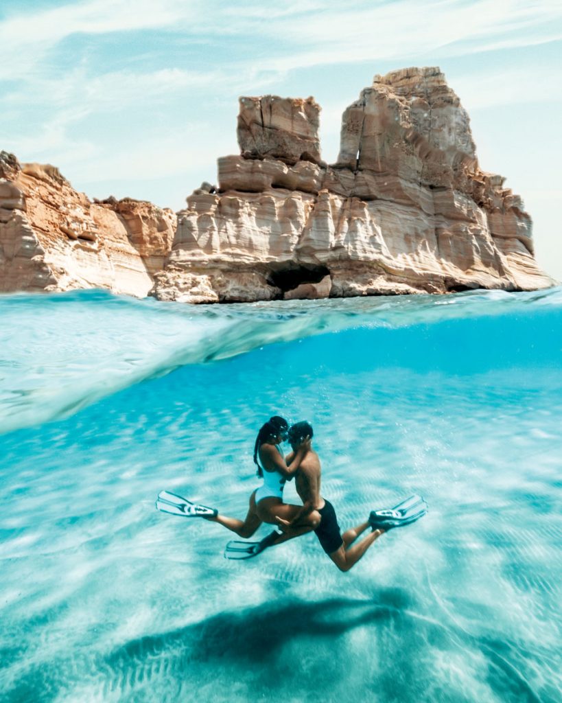Travel influencers Angie Villa and Jeremy Austin explore underwater in Milos, Greece. Photo courtesy of Jeremy Austin and Angie Villa