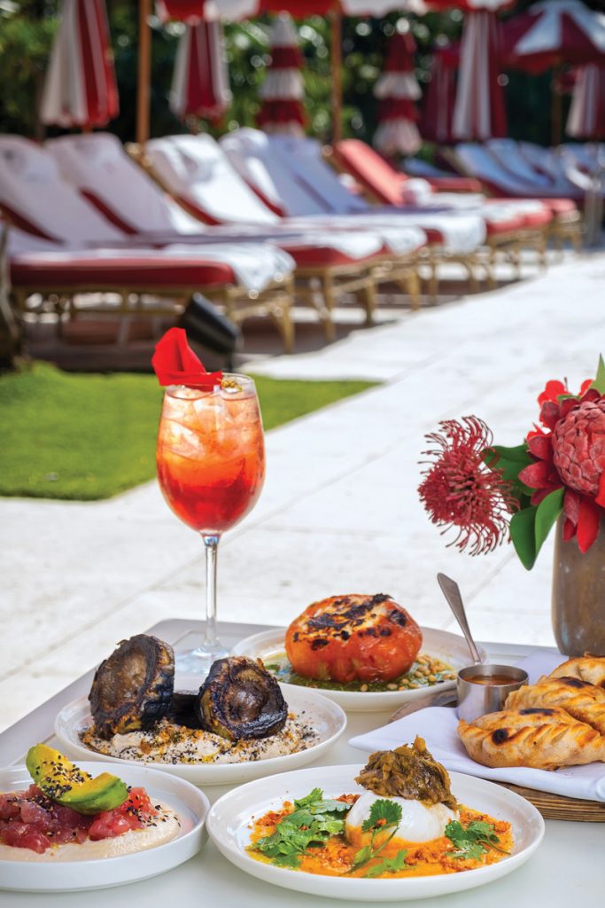 The starter course at Los Fuegos’ Sunday asado includes roasted tomato with ricotta and pesto, fire-roasted artichokes on a bed of sesame cream, empanadas stuffed with hand-cut filet mignon, yellowfin tuna tartare with almond cream, and burrata with romesco sauce and leek vinaigrette.