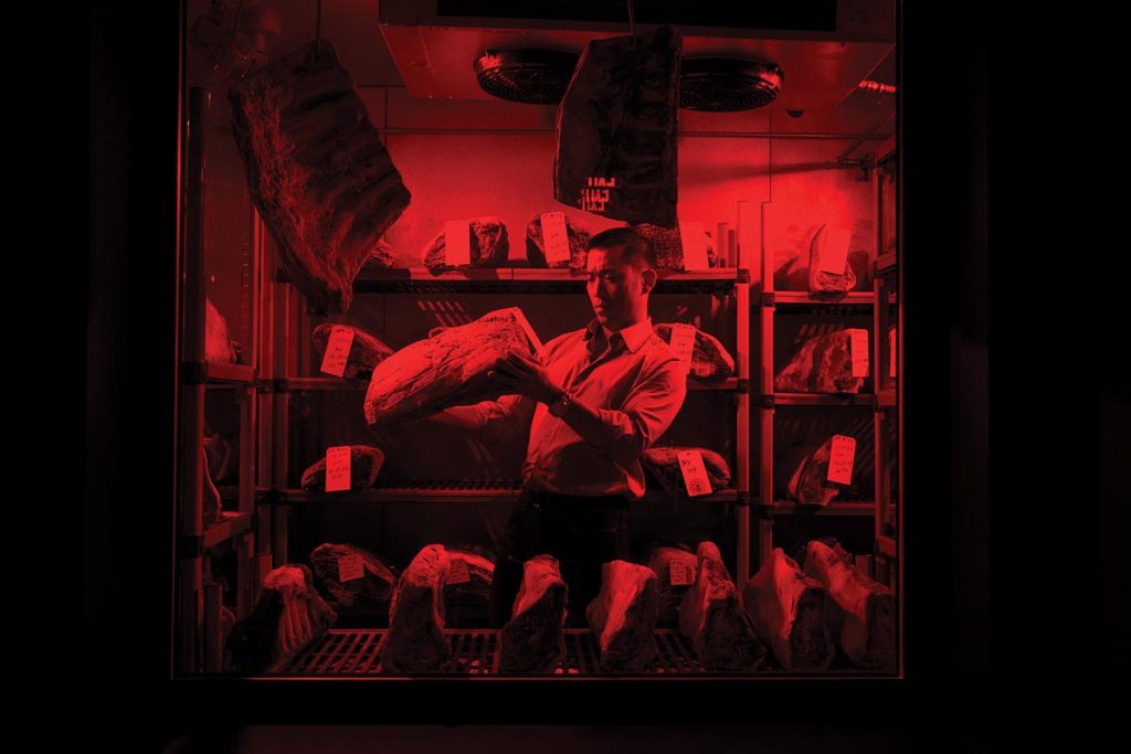 Kim inside Cote’s dry-aging room. Photo by Tolga Kavut