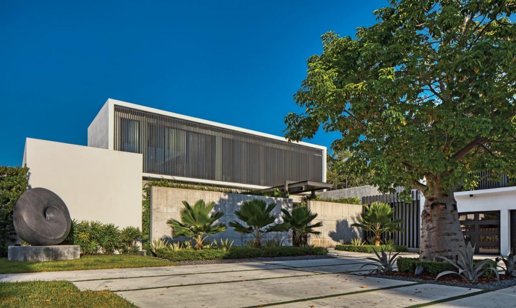 Architect Rafael Portuondo says the aluminum screens he used throughout the home’s exterior not only protect the glass from the intense sun, but also remind him of the old wood jalousie shutters that used to be popular in South Florida dwellings during the 1950s and ’60s.