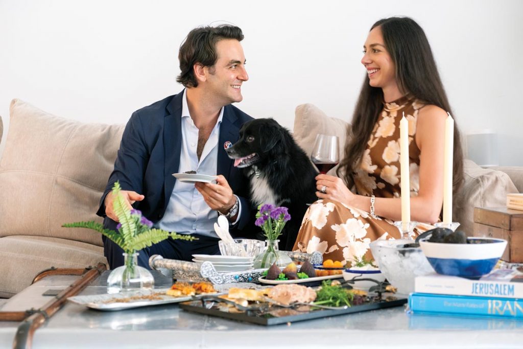 Foulquier and fiancée Danielle Hultman enjoy appetizers with Fooqie, their 9-year-old border collie mix