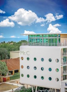 Nautical-inspired porthole windows dot the hotel’s facade