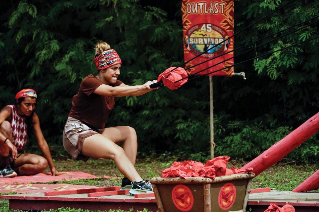 Dee Vallardes aims a sandbag in a slingshot during a reward challenge. Photo by Robert Voets/CBS