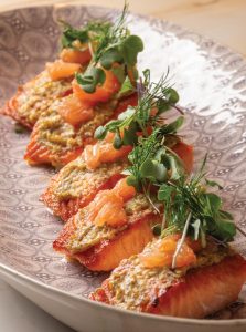 Baked salmon topped with citrus, whole-grain mustard, and dill