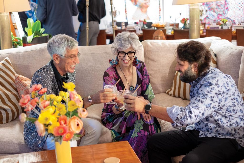 Goldwasser toasts to the holiday with Bruce Halpryn (left), co-owner of Visu Gallery, and Michel Hausmann (right), artistic director of Miami New Drama