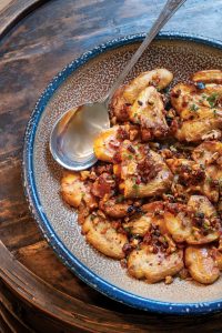 Smashed potatoes with walnut dressing