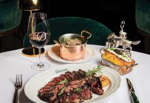Daniel’s Miami Raises the Steaks Porterhouse with a twice baked potato. Photo by The Louis Collection