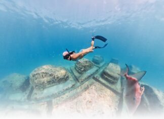 The New Wave of Miami’s Environmental Innovation A snorkeler explores the Reefline, where public art and coral restoration come together beneath the ocean. Photo by Brittany Weber