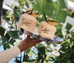 Sip drinks by the pool at the beach club. Photo courtesy of Solei Beach Club