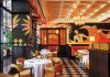 Slim’s Debuts in Bal Harbour Shops The indoor dining room features Art Deco murals by Christoph Niemann. Photo courtesy of Starr Restaurants