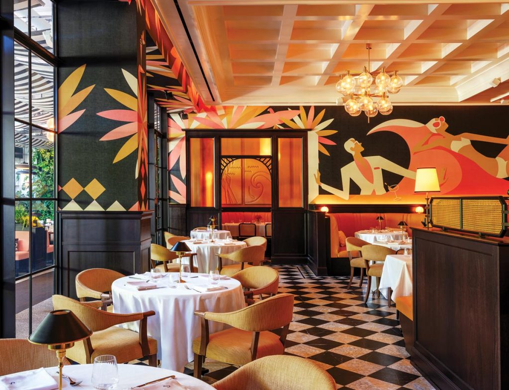 The indoor dining room features Art Deco murals by Christoph Niemann. Photo courtesy of Starr Restaurants